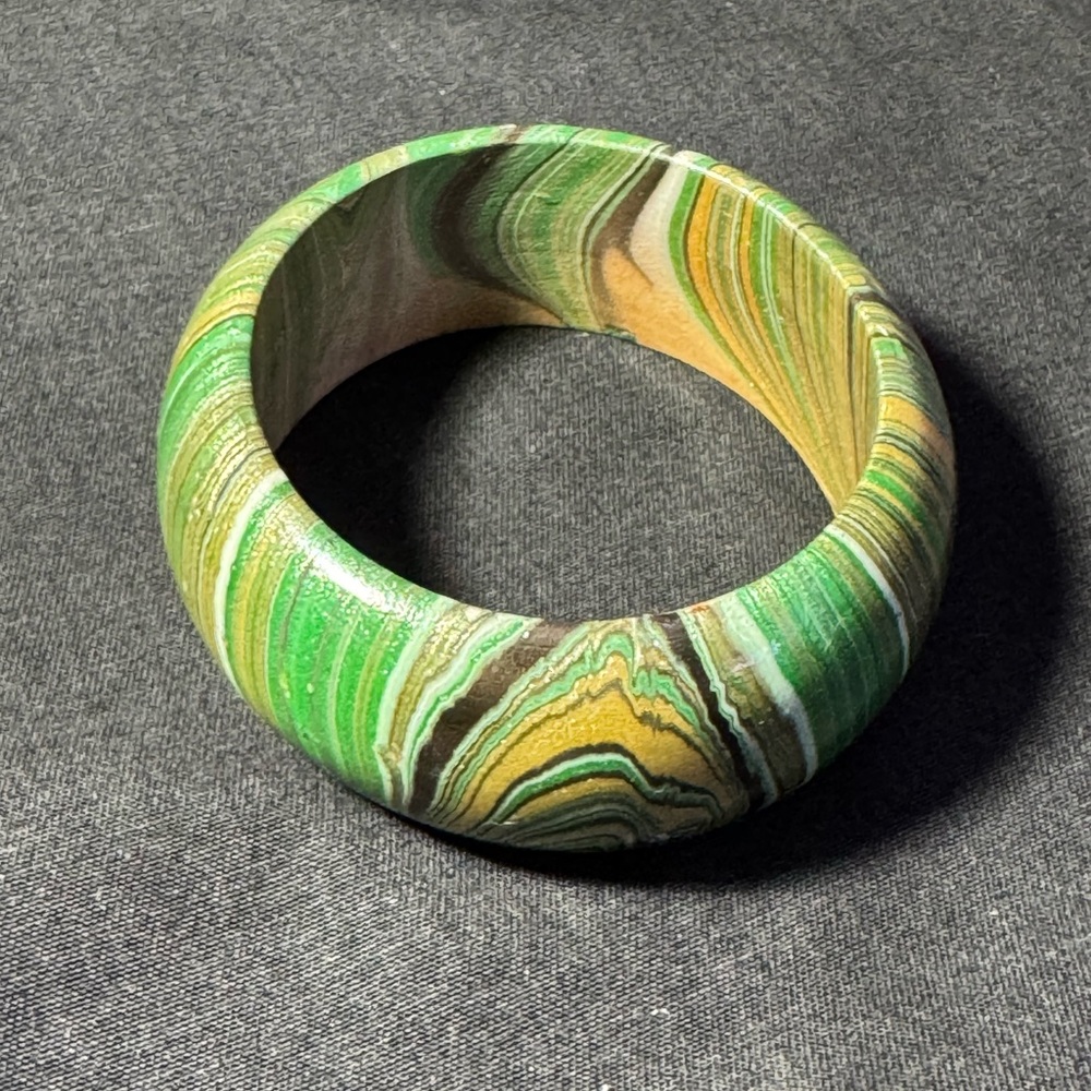 Indonesian hand made wooden bracelet, hand painted with golden sparkles
